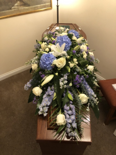 Blue & White Coffin Spray - This unique bespoke Coffin Spray is arranged  using beautiful Blue and White Flowers. It is 5-6ft long